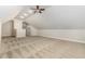 A large bonus room offers plenty of space with a neutral palette and modern ceiling fan at 1096 Silverleaf Dr, Youngsville, NC 27596