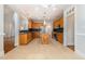 Spacious kitchen featuring an island, stainless steel appliances, and tile floors at 1096 Silverleaf Dr, Youngsville, NC 27596