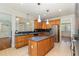 Lovely kitchen boasting an island, stainless appliances, and views into other rooms at 1096 Silverleaf Dr, Youngsville, NC 27596