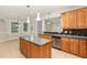 Gorgeous kitchen with an island, stainless appliances, and views to the eating area at 1096 Silverleaf Dr, Youngsville, NC 27596