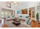 Bright and spacious living room with hardwood floors, high ceilings, comfortable seating, and an open view to the kitchen at 1096 Silverleaf Dr, Youngsville, NC 27596