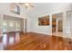 Bright, open living room with hardwood floors and an open view into the kitchen at 1096 Silverleaf Dr, Youngsville, NC 27596