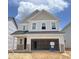 New construction home with a two-car garage and light siding in a residential neighborhood at 1156 Topaz Cave Cir # 862, Raleigh, NC 27529