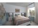 A charming bedroom featuring a white bed frame, blue accent wall and cozy carpet at 11751 Salers Loop Loop, Middlesex, NC 27557