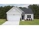 Charming single Gathering home with a two car garage and well maintained lawn at 11751 Salers Loop Loop, Middlesex, NC 27557