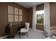 This office features a wooden desk, comfortable chair, and natural light from the window at 11751 Salers Loop Loop, Middlesex, NC 27557
