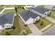 Aerial view of a home featuring a well-kept lawn, landscaping, and an extended driveway at 119 Yadkin St, Clayton, NC 27520