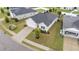 Aerial view of home showing landscaping, paved driveway, and attached garage in a suburban neighborhood at 119 Yadkin St, Clayton, NC 27520