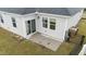 Home's back patio with vinyl siding and sliding glass door, perfect for outdoor entertaining at 119 Yadkin St, Clayton, NC 27520
