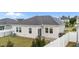 Back of the house with AC and white fence at 119 Yadkin St, Clayton, NC 27520
