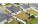 Aerial view of backyard featuring manicured lawn, patio, and privacy fence at 119 Yadkin St, Clayton, NC 27520