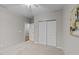 Bedroom features neutral carpet and closet with sliding doors at 119 Yadkin St, Clayton, NC 27520
