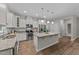 Well-lit kitchen with stainless appliances, island, and ample counter space at 119 Yadkin St, Clayton, NC 27520