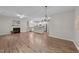 Spacious living area with a fireplace, open kitchen, and modern lighting at 119 Yadkin St, Clayton, NC 27520