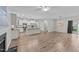 Open-concept living space with hardwood floors adjacent to kitchen and dining areas at 119 Yadkin St, Clayton, NC 27520