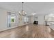 Inviting living room with a fireplace, two windows, and modern decor elements at 119 Yadkin St, Clayton, NC 27520