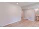 Spacious basement with neutral paint, light wood floors, and a modern half bathroom at 1359 Chowan Ave, Durham, NC 27713