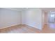 Spacious basement with neutral paint, light wood floors, and easy access to the rest of the house at 1359 Chowan Ave, Durham, NC 27713