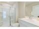 Bright bathroom features a glass shower enclosure, vanity, and white walls at 1359 Chowan Ave, Durham, NC 27713