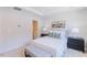 Bright bedroom features neutral walls, modern furniture, decor, and an en suite bathroom at 1359 Chowan Ave, Durham, NC 27713