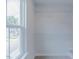 Unfinished closet features wire shelving, white walls, and a window with a view to the community at 1359 Chowan Ave, Durham, NC 27713