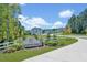 Community entrance featuring sign, landscaped surroundings, leading to new townhomes at 1359 Chowan Ave, Durham, NC 27713