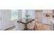 Cozy dining area featuring a wood table with seating, next to the kitchen at 1359 Chowan Ave, Durham, NC 27713