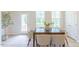 Bright dining room with natural light, featuring a wooden table and seating for six at 1359 Chowan Ave, Durham, NC 27713