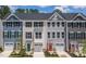 Townhome exteriors showing colorful siding and black framed windows at 1359 Chowan Ave, Durham, NC 27713