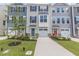 Charming townhomes with garages, colorful doors, and landscaped front yards at 1359 Chowan Ave, Durham, NC 27713