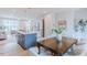 Open concept kitchen with island, wood floors and a view into the living area at 1359 Chowan Ave, Durham, NC 27713
