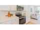 Beautiful kitchen featuring quartz countertops and stainless steel appliances at 1359 Chowan Ave, Durham, NC 27713