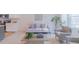 Open-concept living room flowing into the kitchen, creating an ideal space for entertaining at 1359 Chowan Ave, Durham, NC 27713