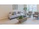 Living room featuring modern furniture and a view of natural light streaming in through the window at 1359 Chowan Ave, Durham, NC 27713