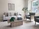 Cozy living room featuring a comfortable sofa, accent chairs, and stylish decor at 1359 Chowan Ave, Durham, NC 27713