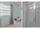 Bright bathroom features a walk-in shower and separate bathtub at 136 Garden Retreat Dr, Garner, NC 27529