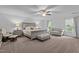 Bright bedroom featuring carpeted floors, neutral walls and a sitting area at 136 Garden Retreat Dr, Garner, NC 27529