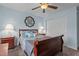 Bedroom featuring neutral walls, carpeted floors, a wood bed frame and matching bedside tables at 136 Garden Retreat Dr, Garner, NC 27529