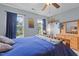 Bedroom featuring carpeted floors, natural light from the window, and a wooden dresser at 136 Garden Retreat Dr, Garner, NC 27529