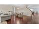 Open-concept dining area featuring hardwood floors, stylish chandelier, and seamless flow into the living spaces at 136 Garden Retreat Dr, Garner, NC 27529