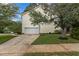 Attached two-car garage with ample parking space and side yard access at 136 Garden Retreat Dr, Garner, NC 27529
