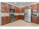 Well-equipped kitchen with stainless steel appliances and ample cabinet space at 136 Garden Retreat Dr, Garner, NC 27529