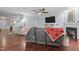 Inviting living room with a fireplace, hardwood floors, and a ceiling fan at 136 Garden Retreat Dr, Garner, NC 27529