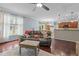 Open living room with hardwood floors that seamlessly connects to the dining area and kitchen at 136 Garden Retreat Dr, Garner, NC 27529