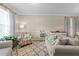 Relaxing living room showcasing a patterned rug, comfortable seating, and elegant decor at 136 Garden Retreat Dr, Garner, NC 27529
