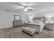 Spacious main bedroom with a queen bed, carpeted floors, and ample natural light at 136 Garden Retreat Dr, Garner, NC 27529