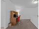 Office featuring carpeted floors, bright white walls and a wooden desk with a red chair at 136 Garden Retreat Dr, Garner, NC 27529