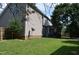View of the backyard featuring the side of the house and covered porch at 136 Wedgewood Ct, Sanford, NC 27332