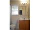 Bathroom features a vanity, toilet and window at 136 Wedgewood Ct, Sanford, NC 27332