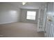 Bedroom featuring neutral walls and carpet, a ceiling fan, and a glass paned doorway at 136 Wedgewood Ct, Sanford, NC 27332